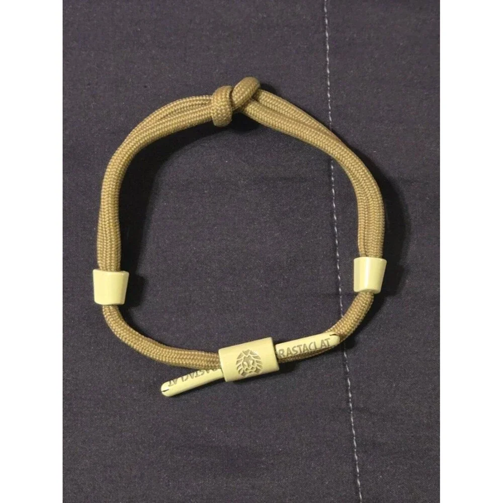 RASTACLAT KNOTTED SHOELACE BRAIDED PULL TO CLOSE BRACELET.